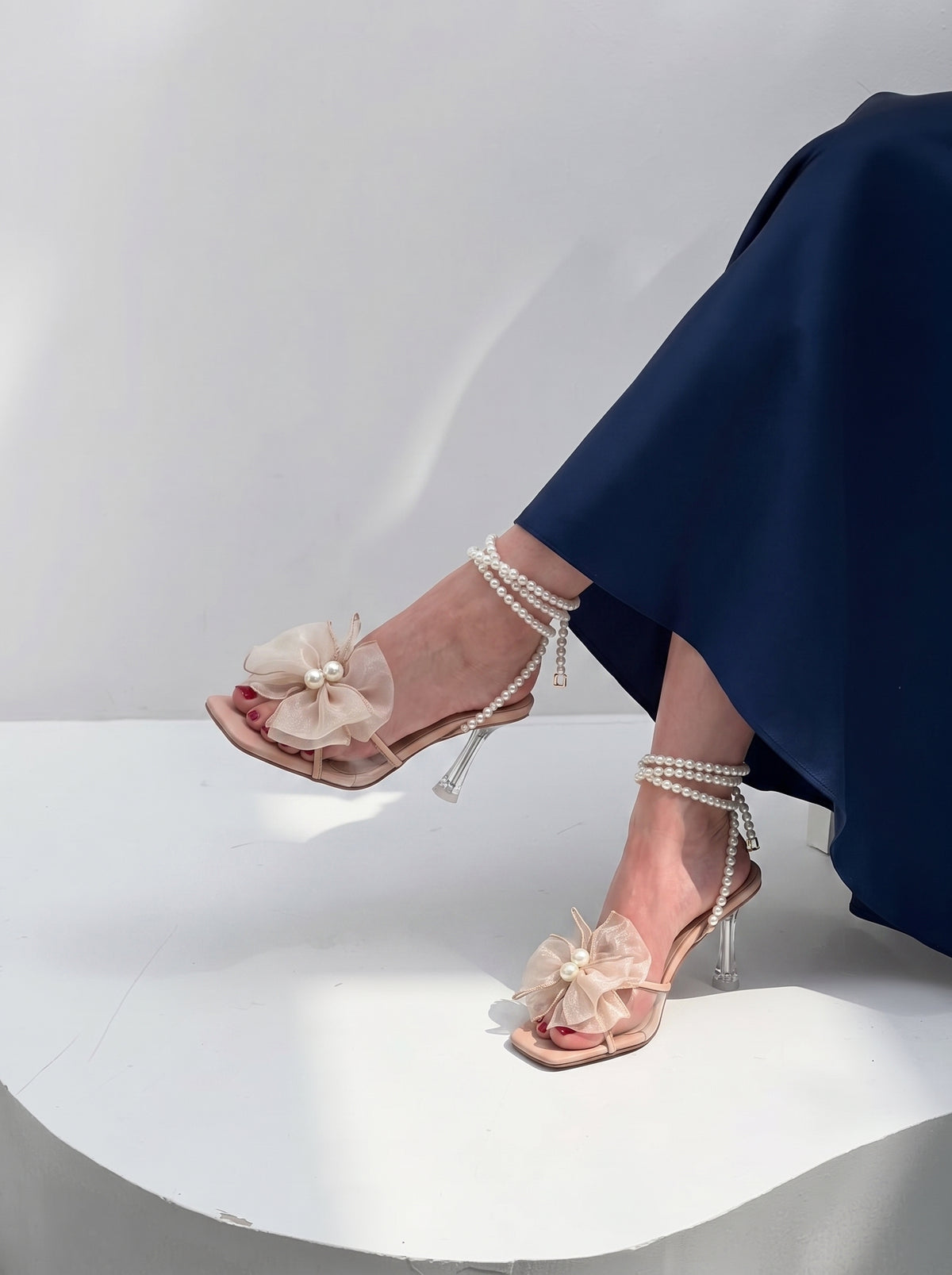 Pearl Bloom heels for women with pearl ankle straps, sheer floral embellishment, open toe and slim transparent-style heel