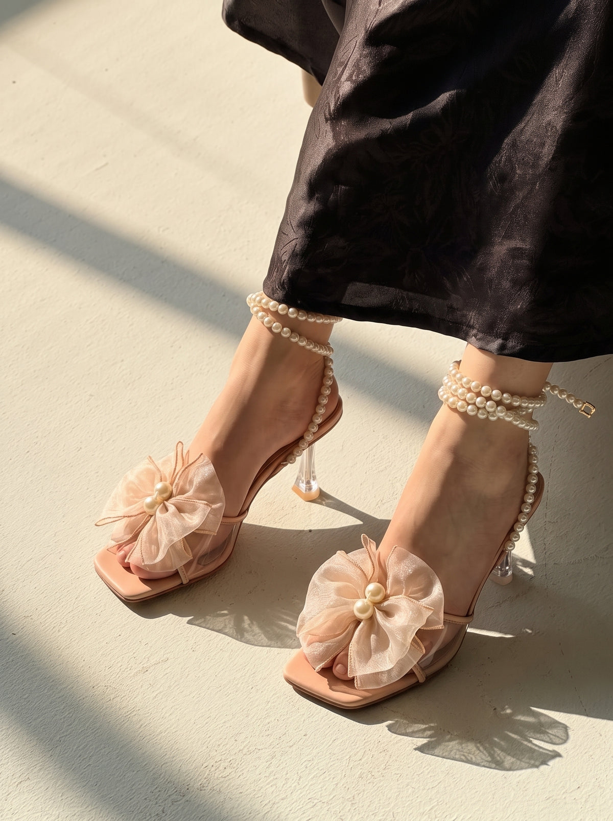 Pearl Bloom heels for women with pearl ankle straps, sheer floral embellishment, open toe and slim transparent-style heel