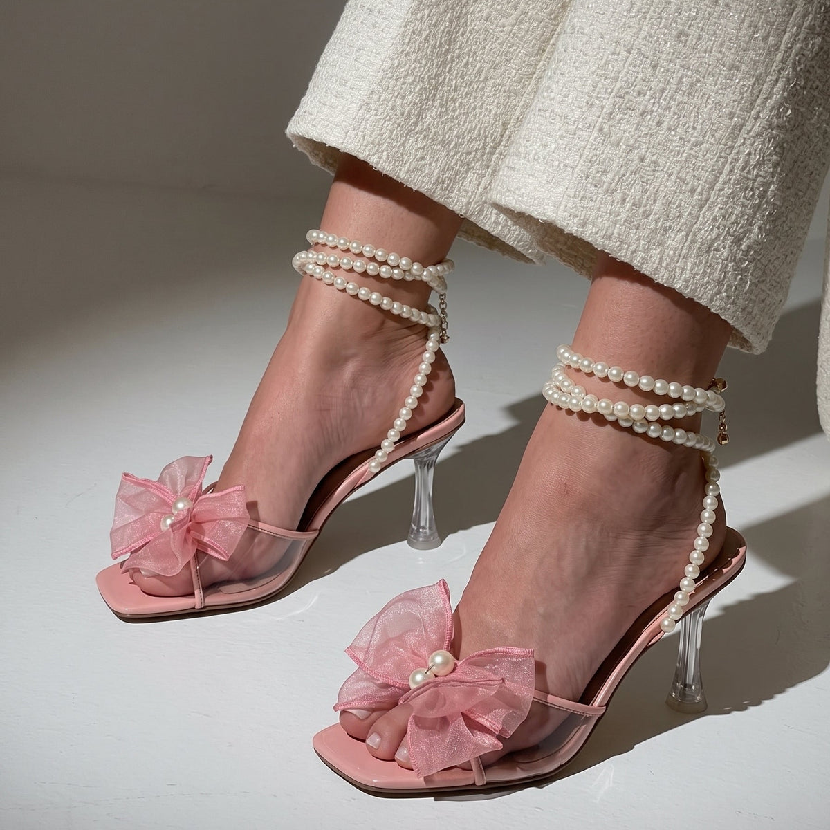 Pearl Bloom heels for women with pearl ankle straps, sheer floral embellishment, open toe and slim transparent-style heel