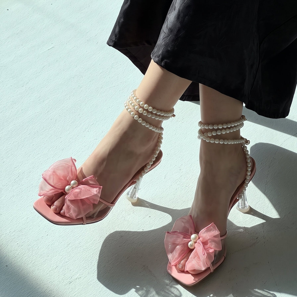 Pearl Bloom heels for women with pearl ankle straps, sheer floral embellishment, open toe and slim transparent-style heel