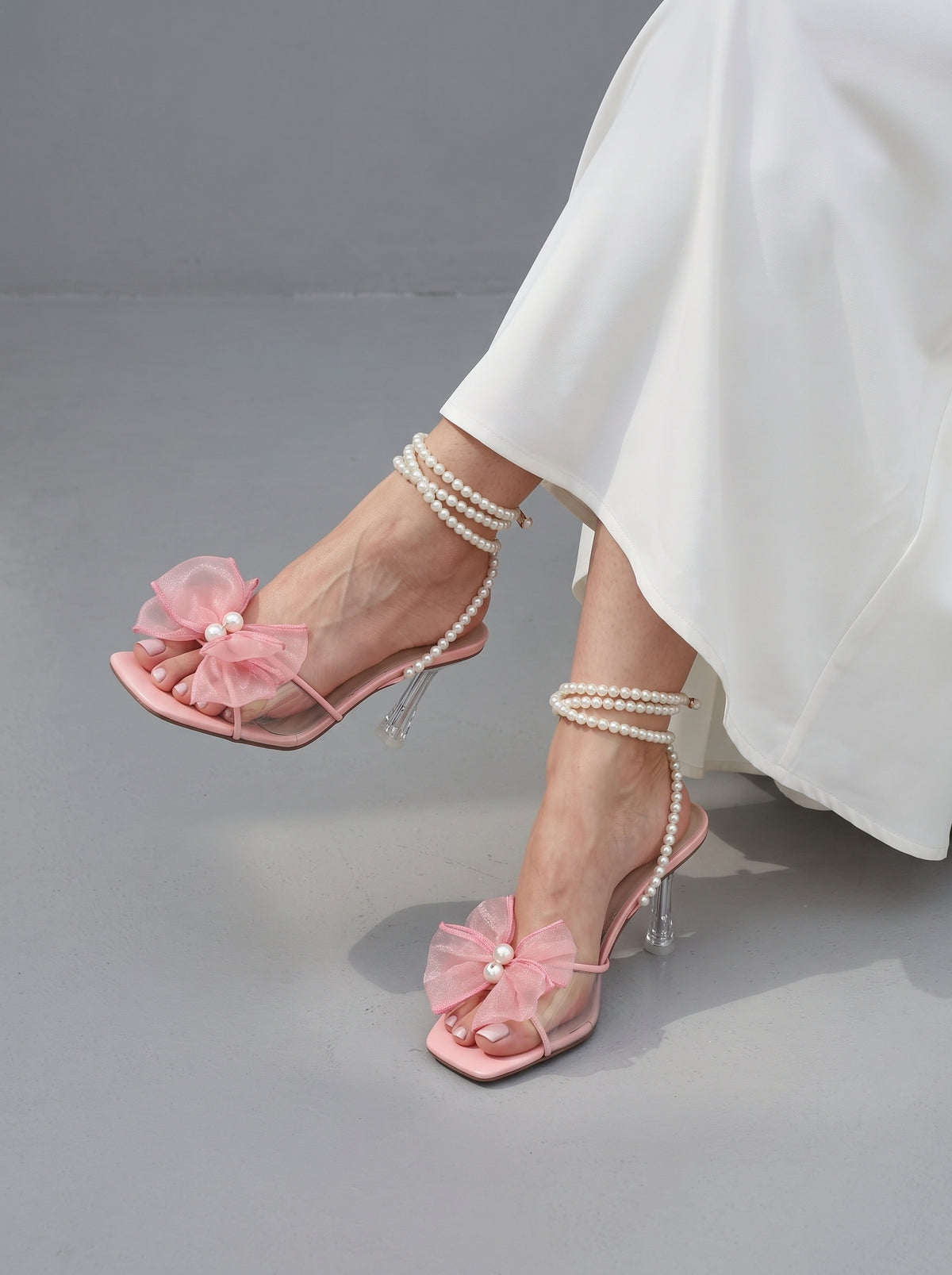 Pearl Bloom heels for women with pearl ankle straps, sheer floral embellishment, open toe and slim transparent-style heel