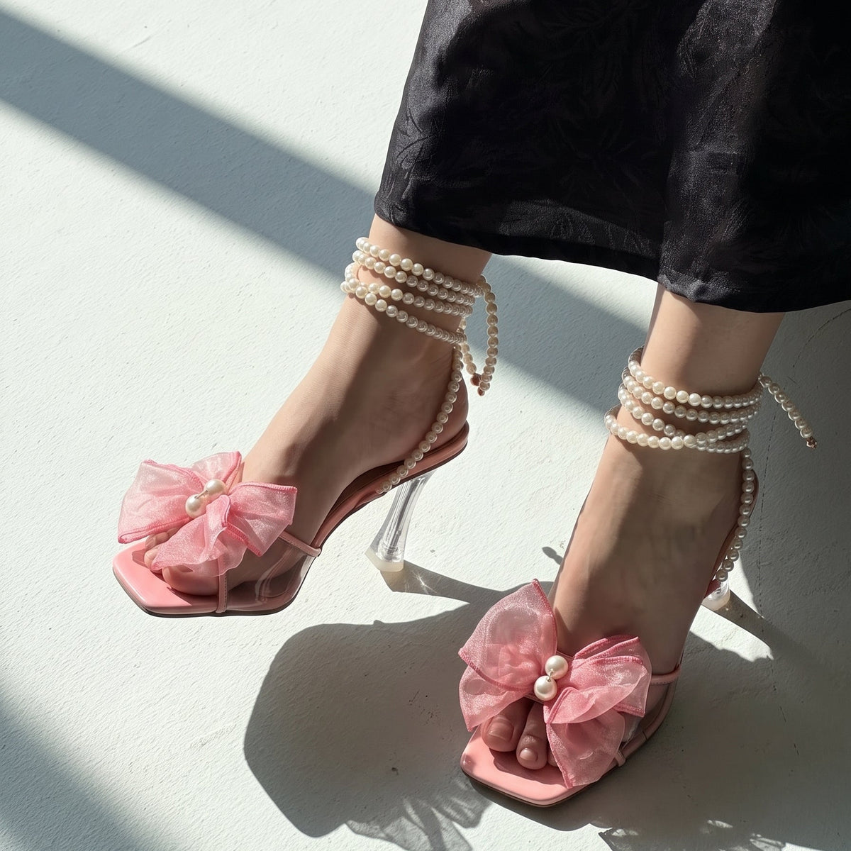 Pearl Bloom heels for women with pearl ankle straps, sheer floral embellishment, open toe and slim transparent-style heel